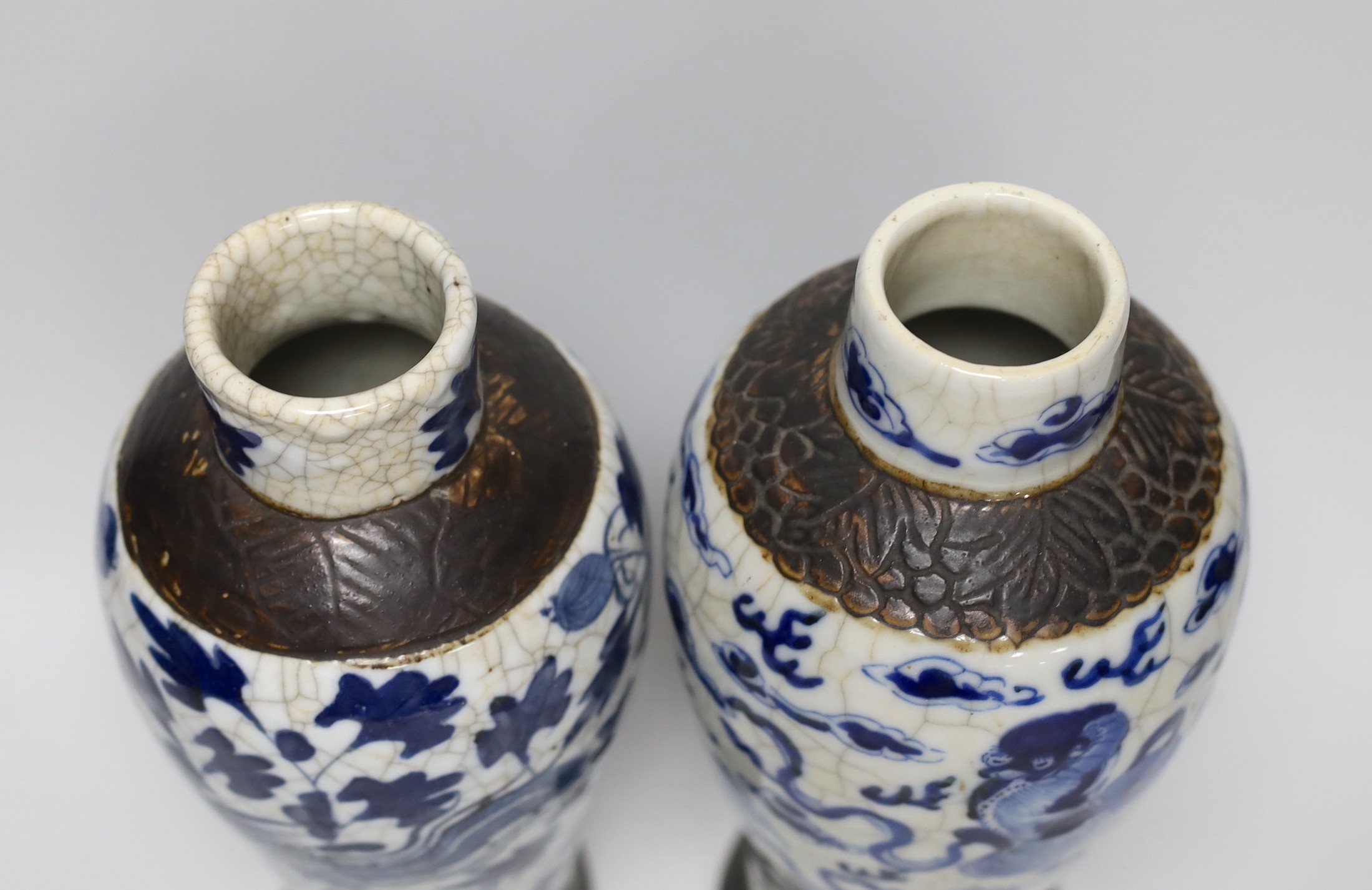 A pair of 19th century Chinese crackleglaze blue and white vases, 27cm